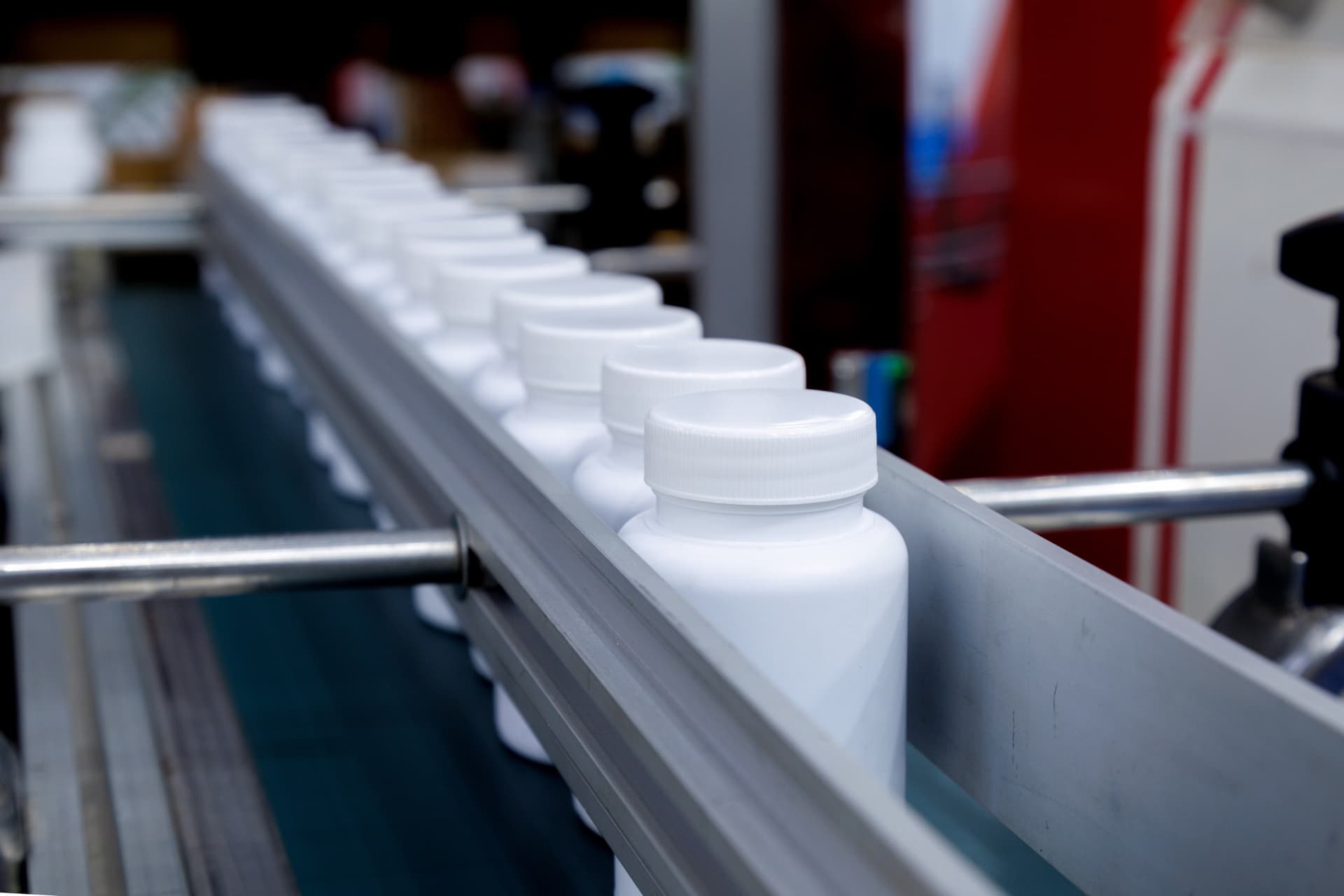 Supplement bottles on a production line